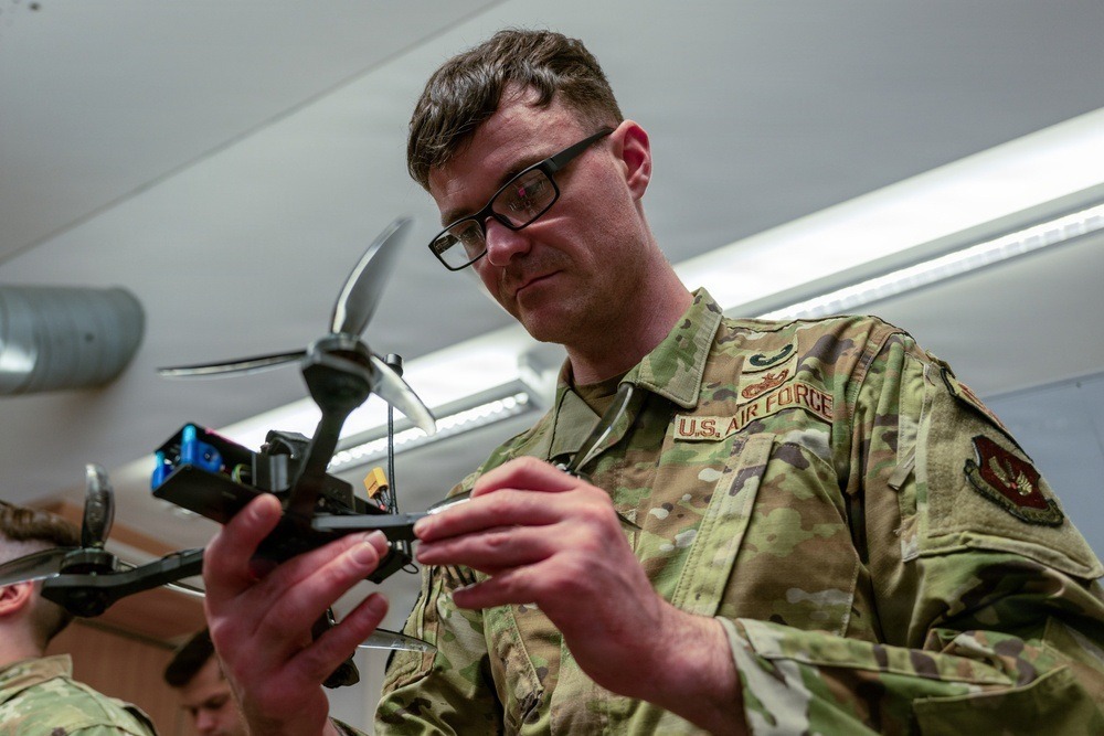 An airman inspects a drone during counter-UAS operator training in Vilseck,Germany,February2026. Public-domain contextual photograph; not FEMA grant-funded equipment or a grant demonstration.