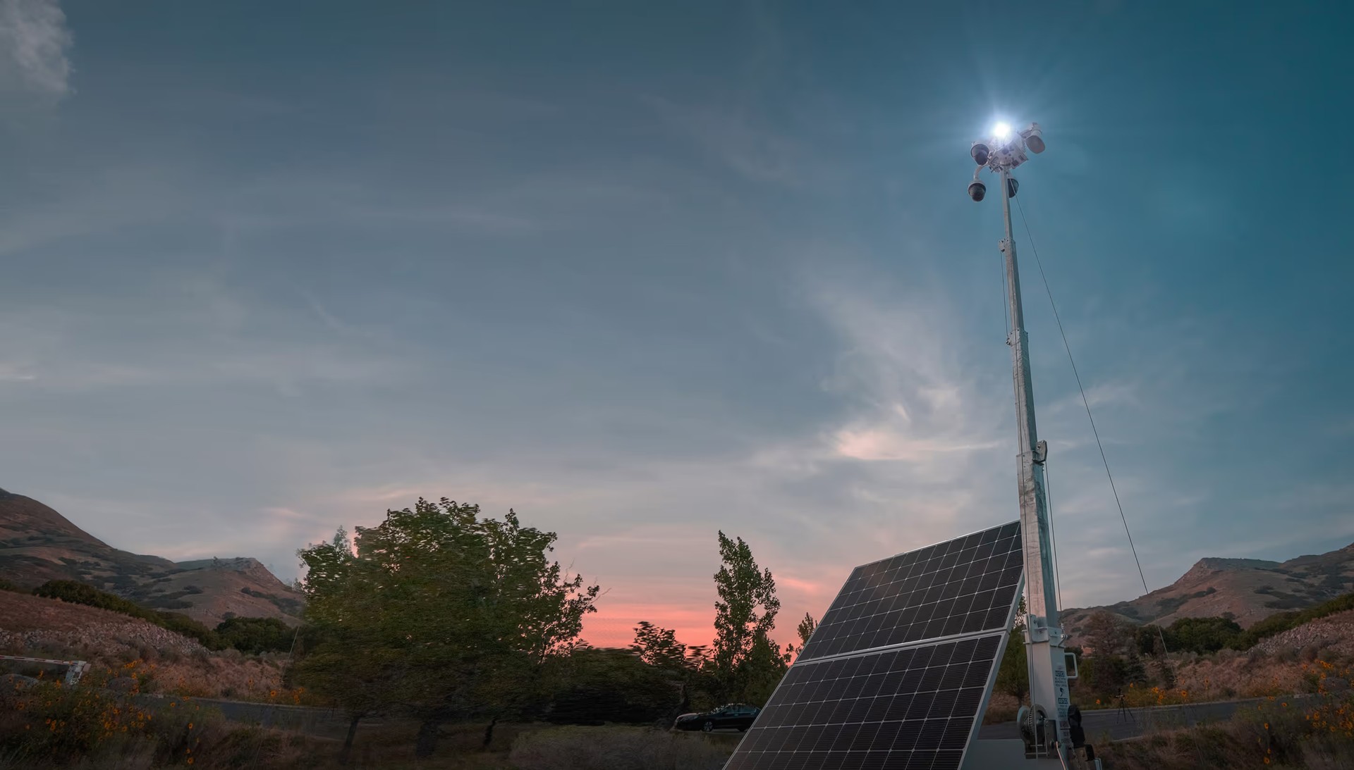 LVT source photograph of a mobile surveillance unit at dusk. Hardware context; the pictured camera is not identified as the newly announced Axis integration.