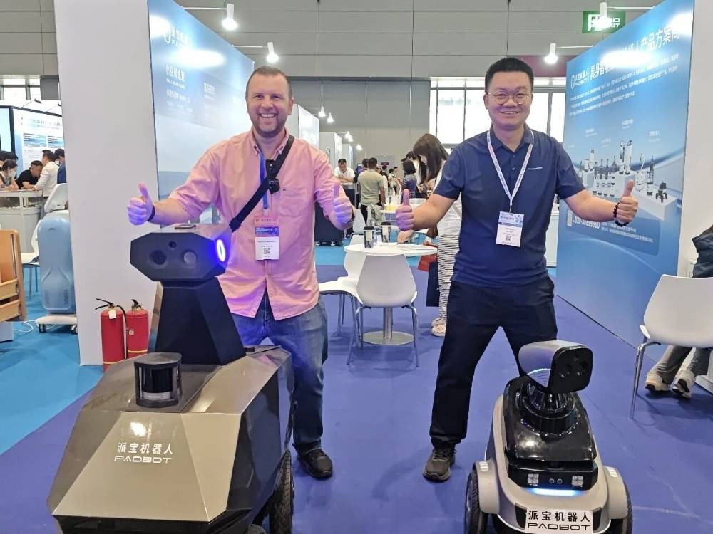 PadBot supplier photograph from its ROBOTECH2026 account, showing patrol robots at the exhibition. A trade-show display does not establish field deployment results.